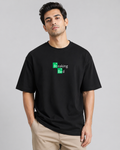 Man wearing a black t-shirt with 'Breaking Bad' logo on a gray background